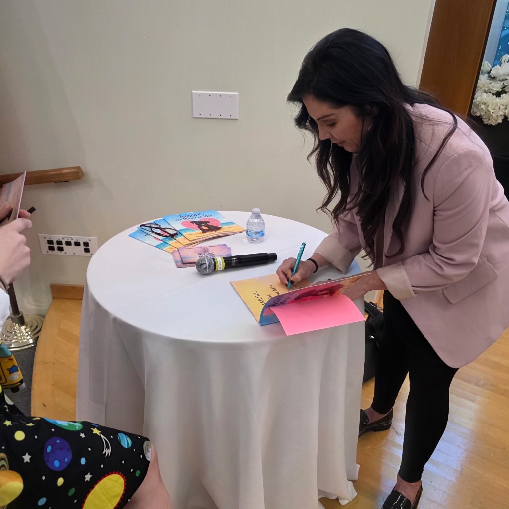 Lisa signing books